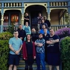 Paranormal investigators gathered outside a historic house