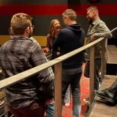 Guests talking with Shana at a theatre event